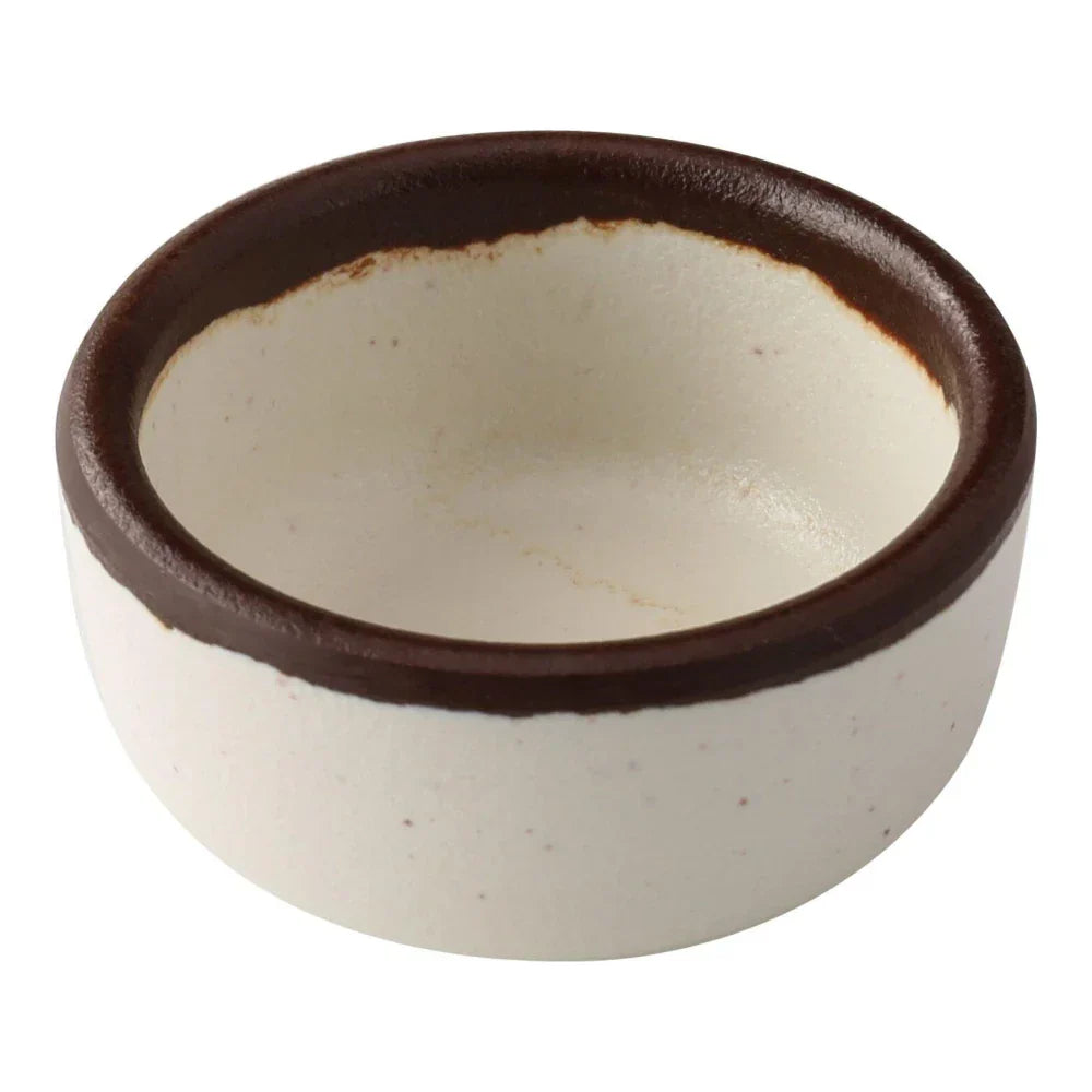 Yanco Sauce Dish NA-5002 Made from high-quality melamine, this server is both durable and lightweight. Its round shape and break-resistant nature make it suitable for frequent use in commercial dining environments. This server is designed to be dishwasher safe, ensuring convenient and efficient cleaning, essential for high-turnover settings. The ivory color with a speckled finish and brown rim adds a sophisticated touch to the presentation of sauces and condiments.