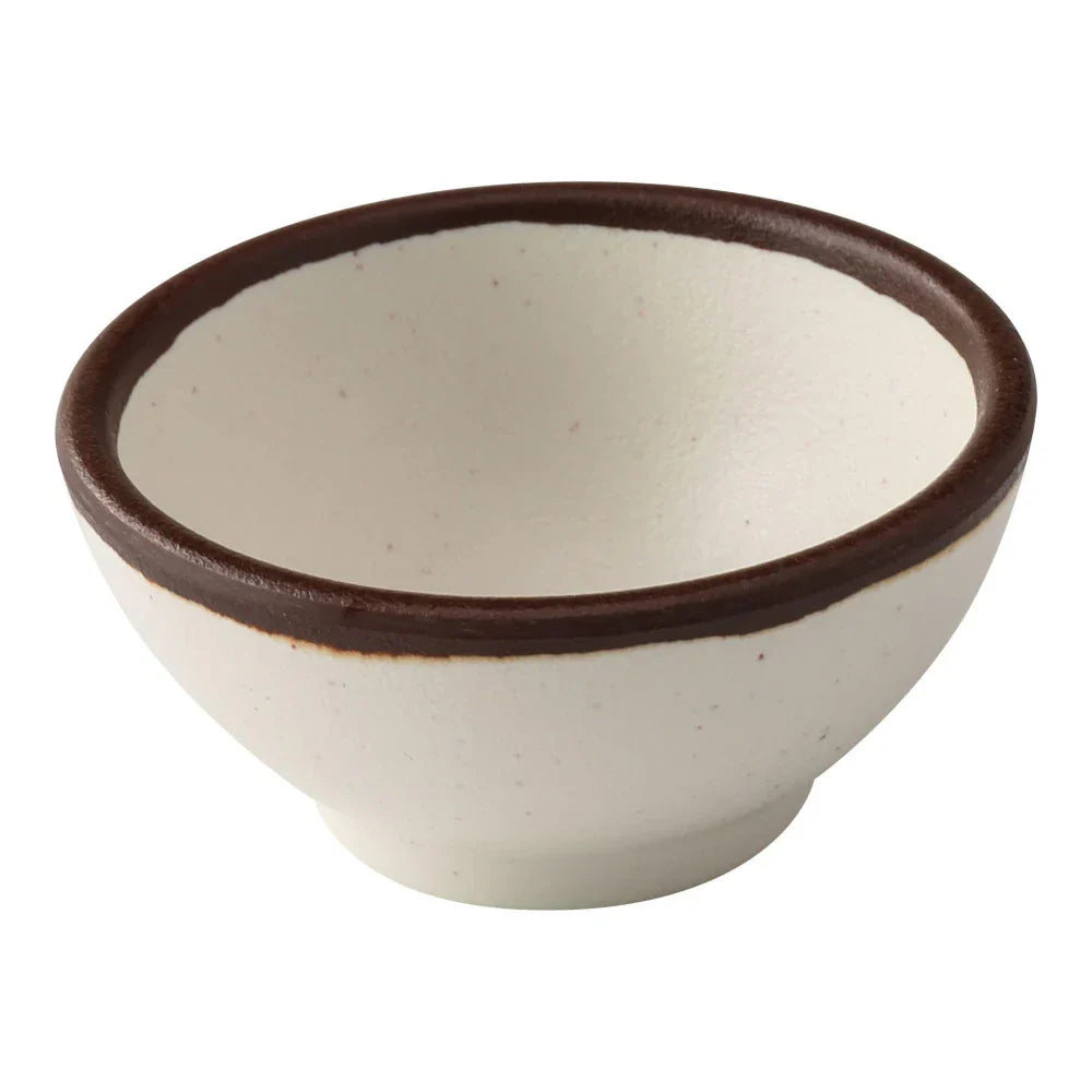 Yanco Sauce Dish NA-5003 Made from high-quality melamine, this server is both durable and lightweight. Its round shape and break-resistant nature make it suitable for frequent use in commercial dining environments. This server is designed to be dishwasher safe, ensuring convenient and efficient cleaning, essential for high-turnover settings. The ivory color with a speckled finish and brown rim adds a sophisticated touch to the presentation of sauces and condiments.