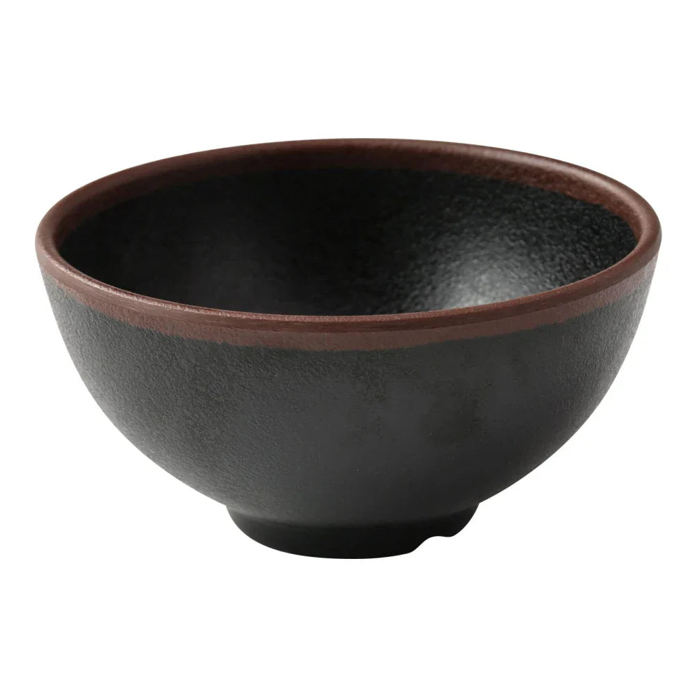 Yanco Rice Bowl NA-504BK Made from durable melamine, this bowl is both break-resistant and lightweight. It holds up to 10 ounces of food, making it suitable for serving rice and other side dishes. Designed for practical use, this bowl is dishwasher safe, which ensures easy and efficient cleaning. It is not microwave safe, preserving its durability and appearance over time. The bowl's elegant black color with a speckled brown rim adds a refined touch to any table setting.