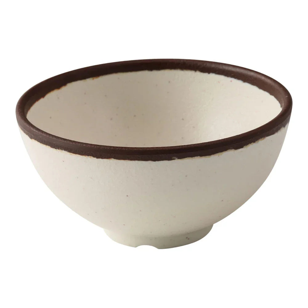 Yanco Rice Bowl NA-504 Made from durable melamine, this bowl is both break-resistant and lightweight. It holds up to 10 ounces of food, making it suitable for serving rice and other side dishes. Designed for practical use, this bowl is dishwasher safe, which ensures easy and efficient cleaning. It is not microwave safe, preserving its durability and appearance over time. The bowl's elegant ivory color with a speckled brown rim adds a refined touch to any table setting.