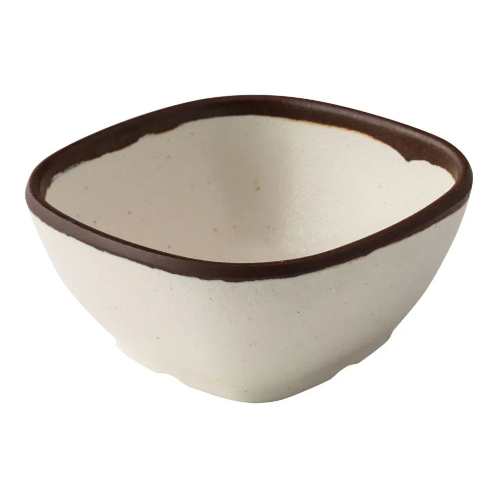 Yanco Square Miso Soup Bowl NA-505 Made from high-quality melamine, this server is durable and lightweight. Its square shape and break-resistant nature make it ideal for frequent use in commercial dining settings. This server is designed to be dishwasher safe, ensuring easy and efficient cleaning, which is essential for high-turnover environments. The ivory color with a speckled finish and brown rim adds a touch of elegance to the presentation of sauces and condiments.