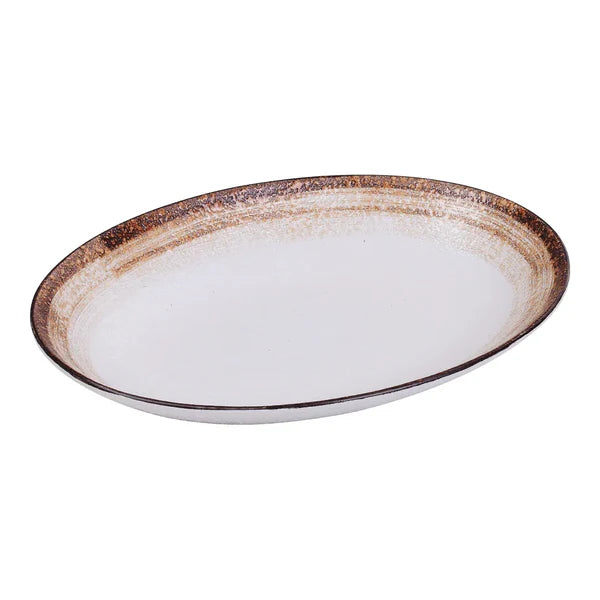Yanco Deep Oval Plate RO-2910 is a stylish and durable choice for serving a variety of dishes. Made from high-quality porcelain with a glazed finish, this deep oval plate features a refined two-tone design in white and brown. Measuring 9.5 inches in length, 7.5 inches in width, and 1.5 inches in height, it offers a 20-ounce capacity, making it ideal for hearty meals and side dishes. Its pebbled texture enhances both visual appeal and functionality by helping to keep food securely in place.