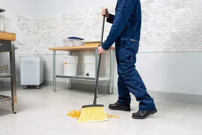 48 Inch Natural Duo-Sweep Flagged Heavy Duty Angle Broom with a black metal handle, 12 Inch angled brush head and flagged synthetic bristles. Built for commercial sweeping in high traffic environments.