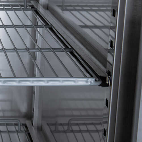 Two-door 54-inch reach-in freezer with a 32-inch depth, stainless steel interior and exterior, 43.93 cubic foot storage capacity, and top-mounted compressor.