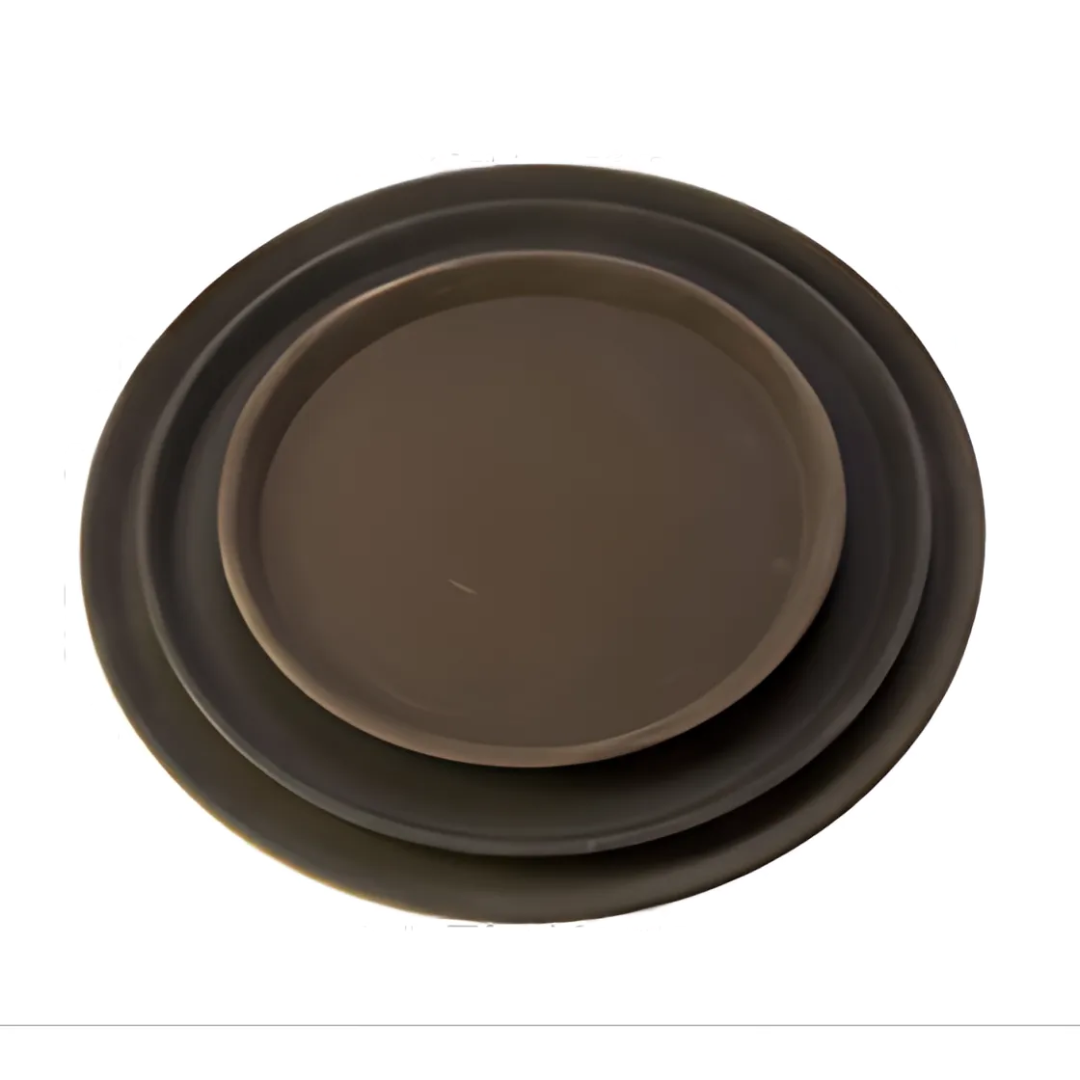 16-inch round black tray stanton trading with a rubber-lined surface, made from fiberglass. This non-slip tray is commonly used in food service settings like restaurants and bars to prevent spills while carrying drinks or plates. The rubber lining provides extra grip, making it a reliable choice for servers and bartenders.