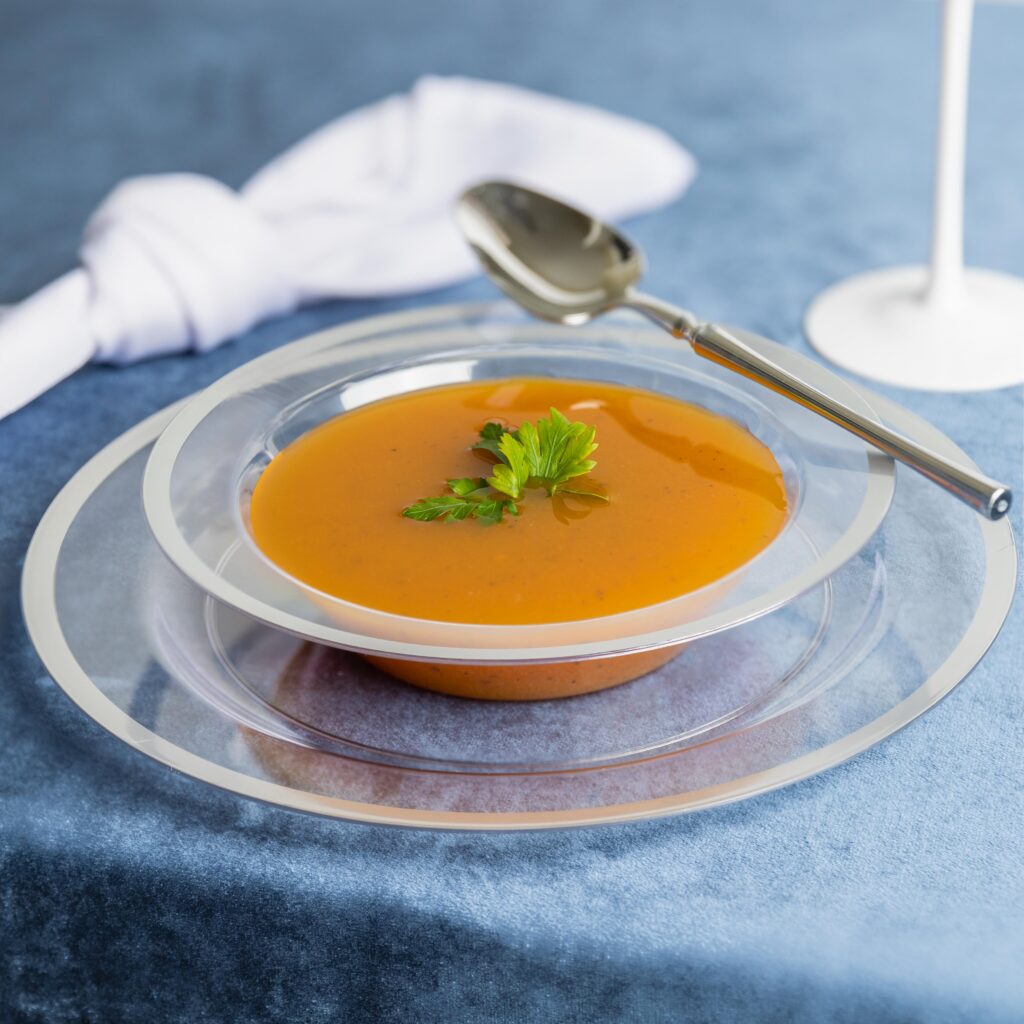 Elegant 12oz clear plastic bowl with a silver rim, ideal for serving soups, salads, or desserts. Durable and stylish, this bowl adds a touch of sophistication to any table setting, perfect for both casual and formal occasions, and easy to dispose of after use.