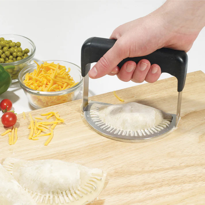 Empanada Fork handy press is the perfect tool for making delicious empanadas quickly and easily. It is constructed of durable stainless steel and features a unique fork design to help you create perfect shapes every time. The ergonomic handle is contoured to fit comfortably in your hand and the press's sturdy construction ensures a lifetime of use.