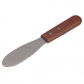 sandwich spreader stanton trading with a serrated stainless steel blade and a wooden handle featuring two rivets. The blade is wide and rounded, designed for spreading condiments, while the serrated edge allows for light cutting. The wooden handle provides a comfortable grip.