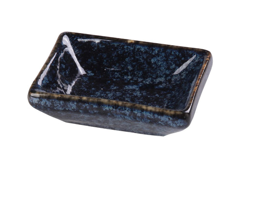 Yanco Sauce Dish BL-4030 is a stylish and practical addition to any table setting. Crafted from high-quality porcelain with a sleek glaze finish, this rectangular dish features a striking blue star pattern that enhances food presentation. Measuring 3" Length x 2 1/4" Width x 3/4" Height and holding 1 oz, it is perfect for serving sauces, dips, and condiments. 