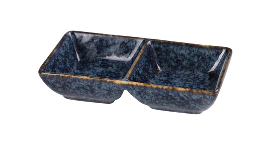 Yanco Double Sauce Dish BL-4032 is a stylish and practical addition to any table setting. Crafted from high-quality porcelain with a sleek glaze finish, this rectangular dish features a striking blue star design that enhances food presentation. Designed with two compartments, it is perfect for serving a variety of sauces, dips, or condiments. Measuring 5 1/2" Length x 3" Width x 1 3/8" Height, this dish is compact yet functional, making it ideal for restaurants, catered events, and home dining. 