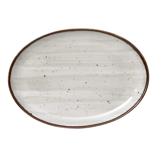 Yanco Coupe Platter LY-2110 is a stylish and versatile addition to any dining setup. Crafted from high-quality porcelain, this platter features a reactive glaze with distinctive brown speckles, adding a rustic yet elegant touch. Its oval shape provides a unique presentation, making it ideal for serving appetizers, main courses, or decorative displays. Built for durability, this platter is designed for high-traffic environments like restaurants, hotels, and cafes. 