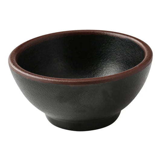 Yanco Sauce Dish NA-5003BK Made from high-quality melamine, this server is both durable and lightweight. Its round shape and break-resistant nature make it suitable for frequent use in commercial dining environments. This server is designed to be dishwasher safe, ensuring convenient and efficient cleaning, essential for high-turnover settings. The black color with a speckled finish and brown rim adds a sophisticated touch to the presentation of sauces and condiments. 