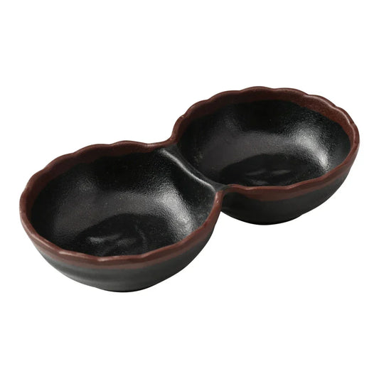 Yanco Two-Divided Sauce Dish NA-506BK Made from durable melamine, it is designed for break resistance and easy handling. This server features two compartments, each with a capacity of 2 ounces, suitable for serving various condiments or sauces. The design includes an black color with a speckled brown rim, adding an attractive touch to the table. It is dishwasher safe, which ensures convenient and thorough cleaning, though it is not microwave safe. 