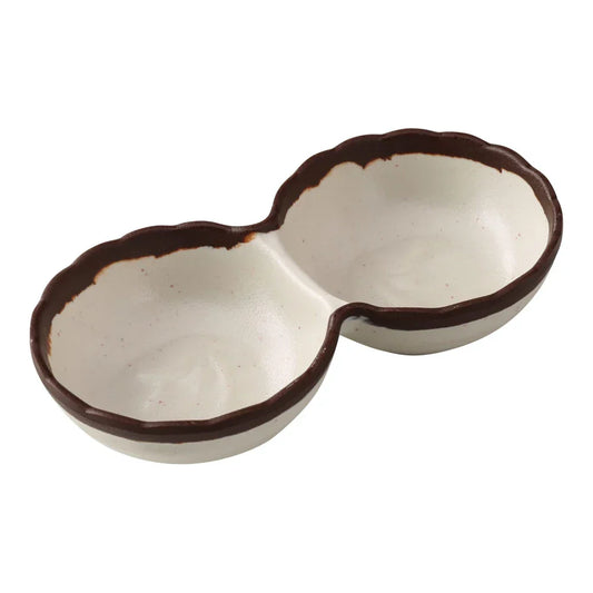 Yanco Two-Divided Sauce Dish NA-506 Made from durable melamine, it is designed for break resistance and easy handling. This server features two compartments, each with a capacity of 2 ounces, suitable for serving various condiments or sauces. The design includes an ivory color with a speckled brown rim, adding an attractive touch to the table. It is dishwasher safe, which ensures convenient and thorough cleaning, though it is not microwave safe. 