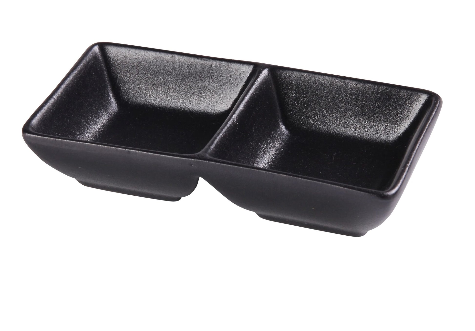 Yanco Double Sauce Dish NB-4032 brings sleek modern elegance to tabletop presentation with its matte black porcelain finish and minimalist rectangular form. Designed with two separate 1.5 ounce compartments, it’s perfect for serving dipping sauces, condiments, oils, spices, and tasting portions. The durable chinaware construction makes it ideal for restaurants, sushi bars, catering services, and contemporary home dining. 