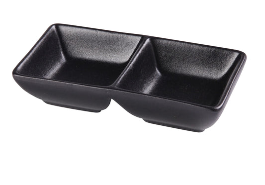 Yanco Double Sauce Dish NB-4032 brings sleek modern elegance to tabletop presentation with its matte black porcelain finish and minimalist rectangular form. Designed with two separate 1.5 ounce compartments, it’s perfect for serving dipping sauces, condiments, oils, spices, and tasting portions. The durable chinaware construction makes it ideal for restaurants, sushi bars, catering services, and contemporary home dining. 
