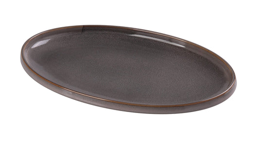 Yanco Oval Plate PK-314 brings a refined, modern elegance to any dining presentation with its smooth oval silhouette and signature gray grainy glaze. Designed for entrées, shareable dishes, appetizers, and chef-forward plating, this 14 × 9-inch porcelain plate delivers both beauty and durability. Its subtle earth-tone finish elevates food contrast, making every dish stand out effortlessly in restaurants, hotels, catering services, or stylish home dining.