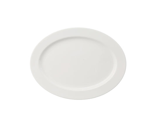 Yanco Platter VS-210 is an elegant serving solution for appetizers, shared dishes, and small entrees. Made from fully glazed porcelain with a durable magnesia body, this bone white platter combines a refined appearance with reliable strength, perfect for upscale restaurants, hotels, and banquet presentations.