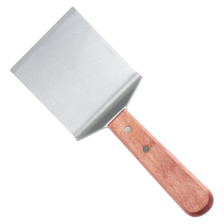 Giant Turner w/ Offset 12/Pack &nbsp;is built with a flat stainless steel blade, easily slides under food and is strong enough to withstand heat without warping. This turner is a great addition to any kitchen to safely flip burgers or steak on the grill. To keep your hands safely away from heat, this steak turner has a comfortable wooden handle. This model is also dishwasher safe for quick and easy cleaning.