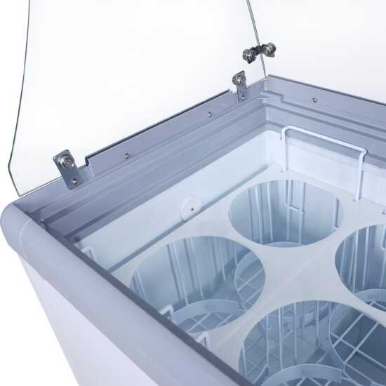 The Coldline DP-560-FSG is a 71" ice cream dipping cabinet freezer with a 12-tub capacity and a sneeze guard. Ideal for medium to large commercial spaces, it keeps ice cream at perfect temperatures while offering hygienic protection.