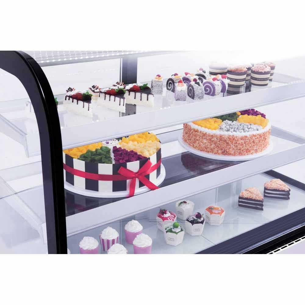 The Marchia MB48 48-inch Curved Glass Refrigerated Bakery Display Case in stainless steel, designed to elegantly display a variety of baked goods, pastries, and desserts while maintaining optimal freshness. Ideal for bakeries, cafés, and delis.