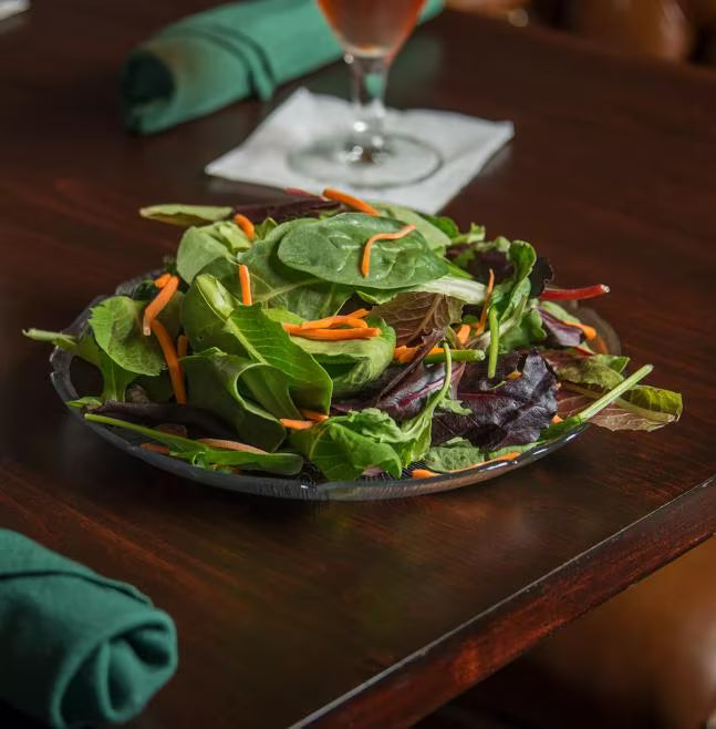 9 Inch Clear Polycarbonate Petal Mist Plate with break resistant construction. Ideal for salads, entrees, buffets, catering, restaurants, and home entertaining.