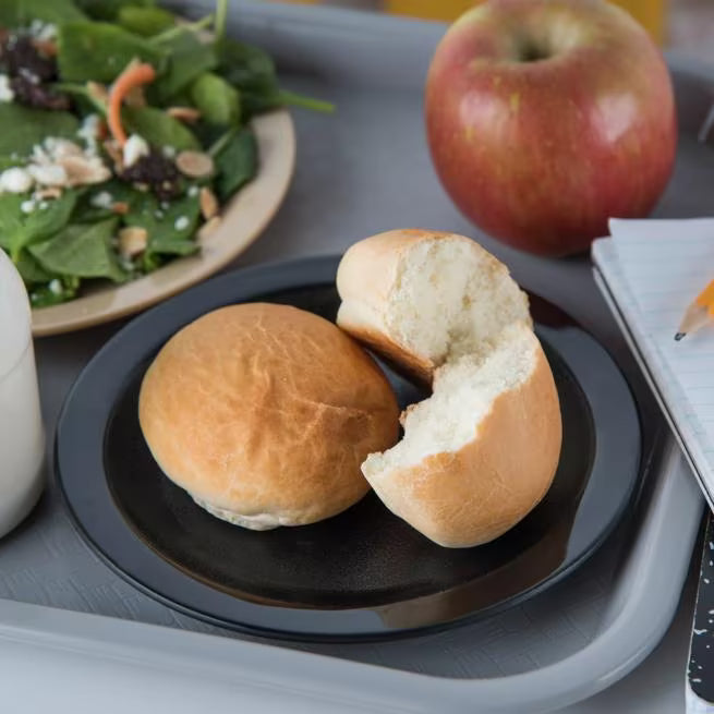 6.5 Inch Black Polycarbonate Narrow Rim Plate with break resistant construction and scratch resistant surface. Ideal for restaurants, cafeterias, catering, and commercial foodservice.