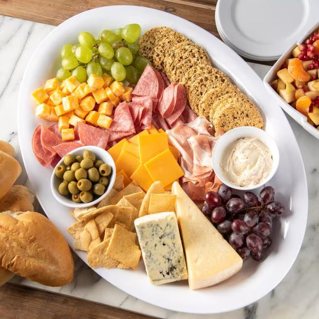 12 x 8.5 Inch White Melamine Oval Platter Tray with commercial grade durability and temperature insulated construction. Ideal for restaurants, cafes, catering, buffets, outdoor dining, and home entertaining.