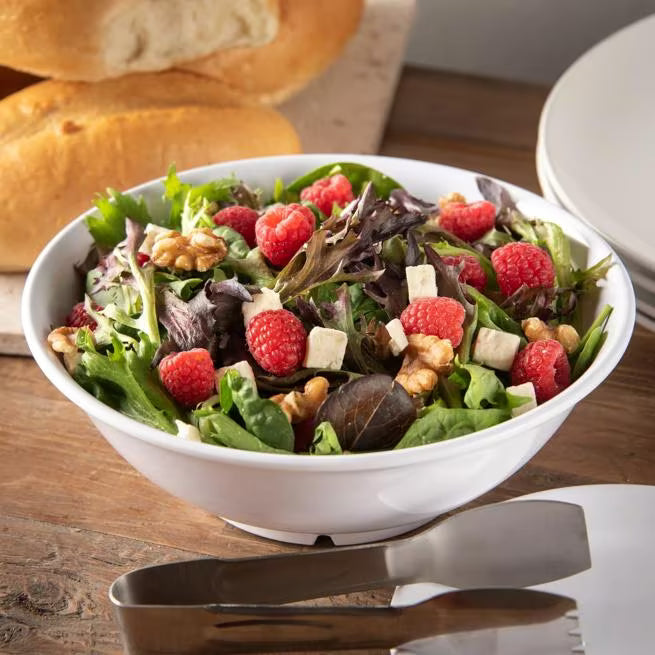 36 oz White Melamine Footed Serving Bowl with commercial grade durability and temperature insulated construction. Stain resistant and chip resistant for restaurants, cafes, catering, buffets, and home dining.