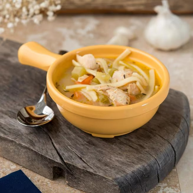 8 oz Honey Yellow Handled Soup Bowl with durable commercial grade SAN construction, thick walled heat retaining design and an integrated handle. Ideal for soups, broths, chili, stews and hot beverages.