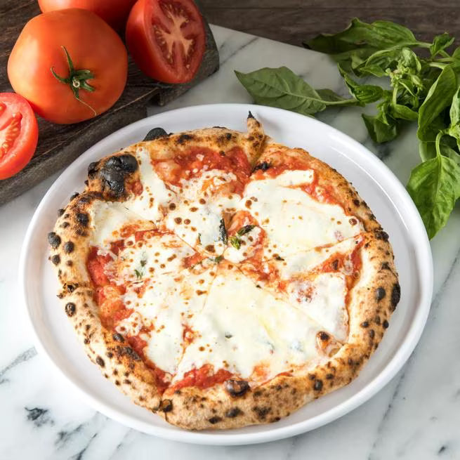 10.5 Inch White Stadia Melamine Dinner Plate with commercial grade break resistant construction and a modern organic shape. Perfect for serving entrees, pasta, seafood, sandwiches and complete meals.