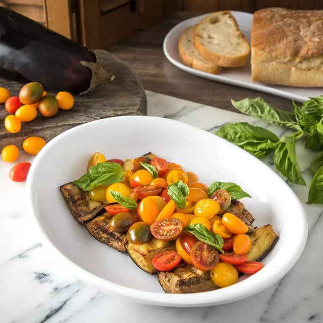 11.5 Inch White Stadia Melamine Pasta Plate with commercial grade break resistant construction and a modern organic shape. Perfect for serving generous portions of pasta, risotto, salads, grain bowls and specialty entrees.