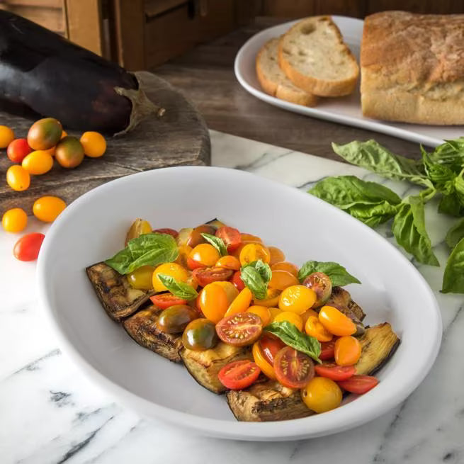 11.5 Inch Greige Stadia Melamine Pasta Plate with commercial grade break resistant construction and a modern organic shape. Perfect for serving generous portions of pasta, risotto, salads, grain bowls and specialty entrees.