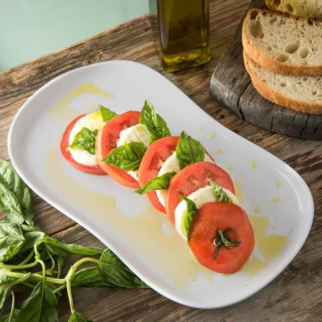 13 Inch x 7 Inch Greige Stadia Melamine Platter with commercial grade break resistant construction and a modern organic shape. Perfect for serving appetizers, seafood, sandwiches, entrees, desserts and shared dishes.