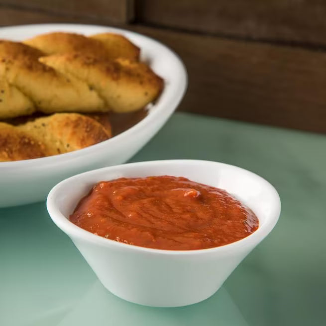 4 oz White Stadia Melamine Sauce Cup with commercial grade break resistant construction and a modern organic shape. Perfect for serving dipping sauces, condiments, dressings, salsa, butter and toppings.