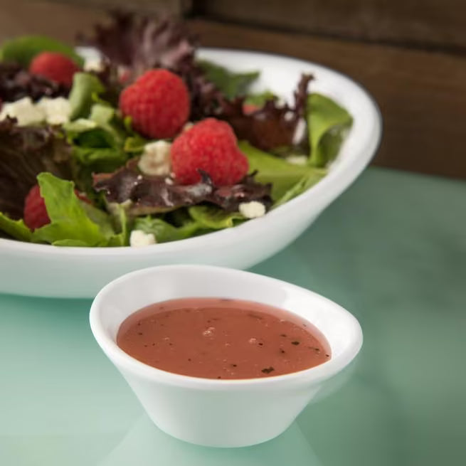 2 oz White Stadia Melamine Sauce Cup with commercial grade break resistant construction and a modern organic shape. Perfect for serving dipping sauces, condiments, dressings, salsa, butter, seasonings and tasting portions.