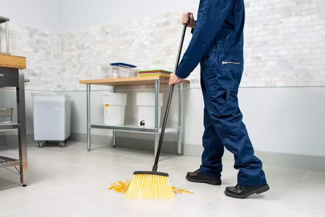 48 Inch Natural Duo-Sweep Unflagged Heavy Duty Angle Broom with a black metal handle and a 12 Inch angled brush head. Designed for heavy duty commercial sweeping in warehouses and other demanding environments.
