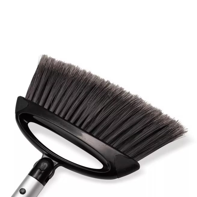 Black Duo-Pan Upright Dust Pan and Broom Set with a space-saving nesting design, adjustable broom head, low-profile dust pan edge and frayed bristles for efficient commercial cleaning.
