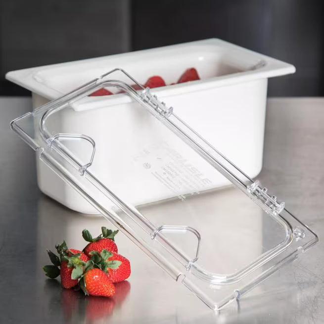 Protect and access food easily with the Clear Coldmaster EZ Access Lid One Third Size CM10278Z07. This dishwasher safe polycarbonate hinged lid features a secure snap on design and is ideal for restaurants, buffets, catering operations, and commercial kitchens.