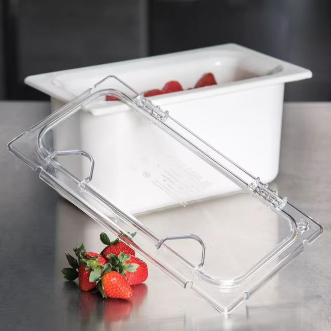 Improve food service with the Clear Coldmaster EZ Access Lid with Notch One Third Size CM10279Z07. This dishwasher safe polycarbonate hinged lid features a utensil notch and secure snap on design, making it ideal for restaurants, buffets, catering operations, and commercial kitchens.
