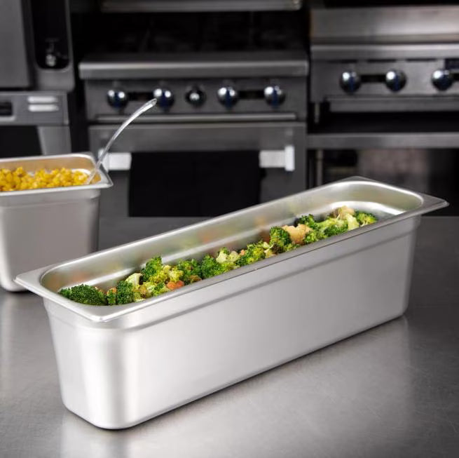 Prepare and serve food efficiently with the DuraPan Light Gauge Stainless Steel Steam Table Long Hotel Pan Long 1/2 Size 6 Inch Deep 60700HL6. Features spoonable bottoms, freezer-to-oven versatility, and Coldmaster compatibility.