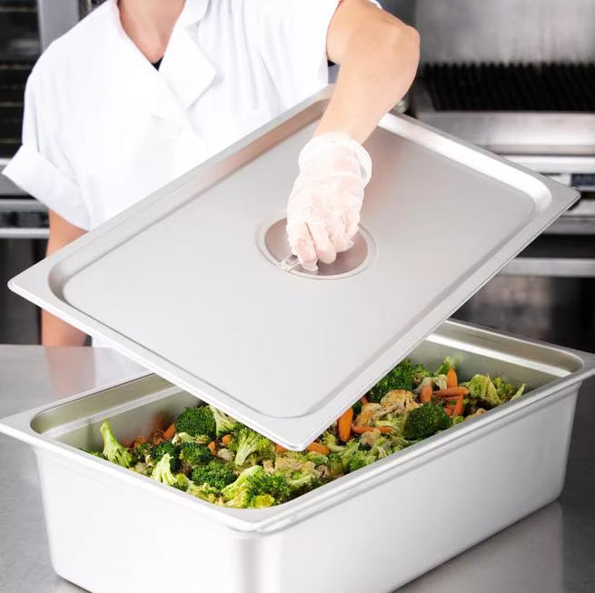 Protect food with the DuraPan Stainless Steel Steam Table Hotel Pan Handled Cover Full-Size 607000C. Features heavy gauge stainless steel construction and a comfortable concave handle.