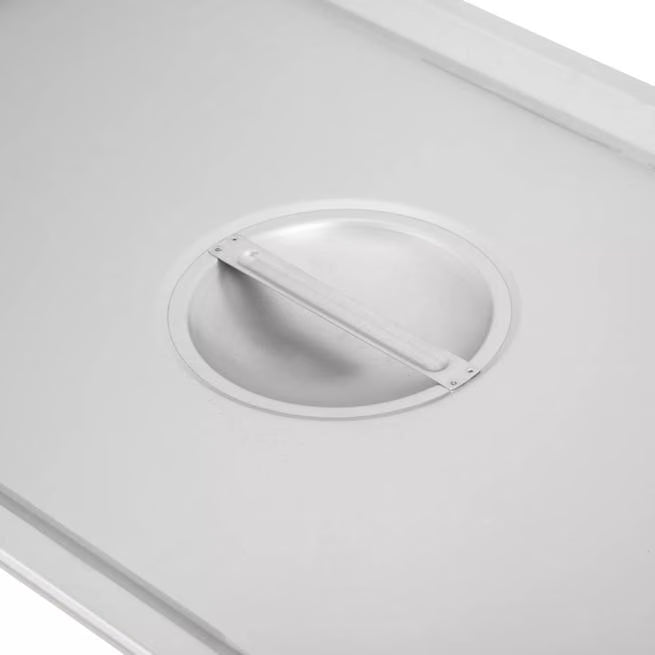 Protect and serve food efficiently with the DuraPan Stainless Steel Hotel Pan Slotted Handled Cover Full-Size 607000CS. Features heavy gauge stainless steel, a serving spoon notch, and a comfortable concave handle.