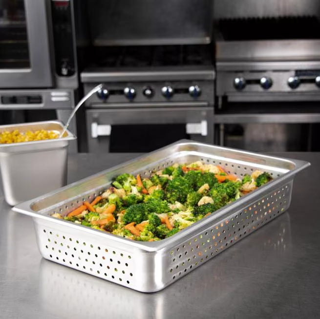 Steam and drain food efficiently with the DuraPan Light Gauge Stainless Steel Perforated Steam Table Hotel Pan Full-Size 4 Inch Deep 607004P. Features a perforated design, spoonable bottoms, freezer-to-oven versatility, and Coldmaster compatibility.