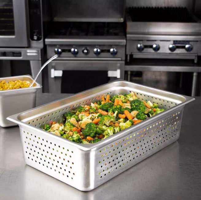 Steam and drain food efficiently with the DuraPan Light Gauge Stainless Steel Perforated Steam Table Hotel Pan Full-Size 6 Inch Deep 607006P. Features a perforated design, spoonable bottoms, freezer-to-oven versatility, and Coldmaster compatibility.