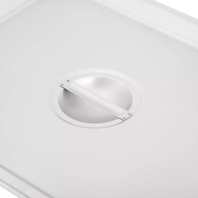 Protect and serve food efficiently with the DuraPan Stainless Steel Hotel Pan Slotted Handled Cover 1/2 Size 607120CS. Features heavy gauge stainless steel, a serving spoon notch, and a comfortable concave handle.