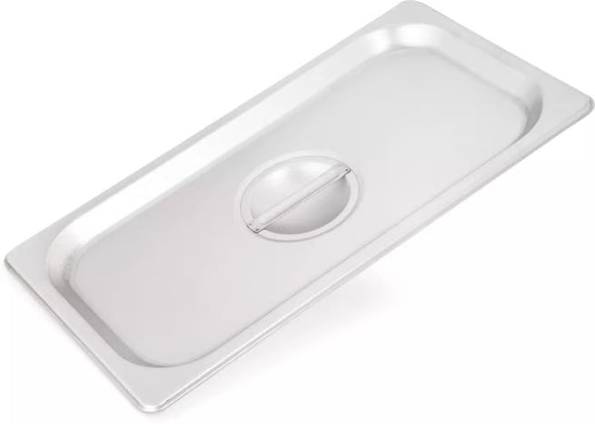 Protect food with the DuraPan Stainless Steel Steam Table Hotel Pan Handled Cover 1/3 Size 607130C. Features heavy gauge stainless steel construction, a comfortable concave handle, and dishwasher-safe cleaning.