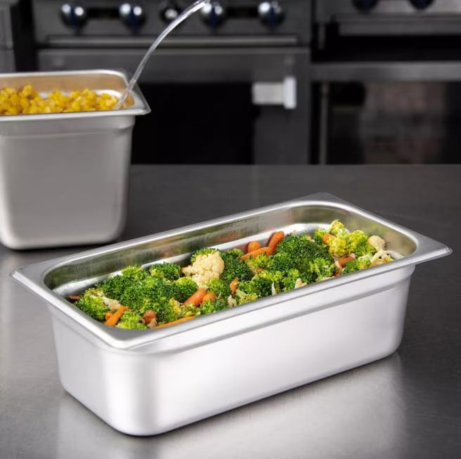 Prepare and serve food efficiently with the DuraPan Light Gauge Stainless Steel Steam Table Hotel Pan 1/3 Size 4 Inch Deep 607134. Features spoonable bottoms, freezer-to-oven versatility, and Coldmaster compatibility.