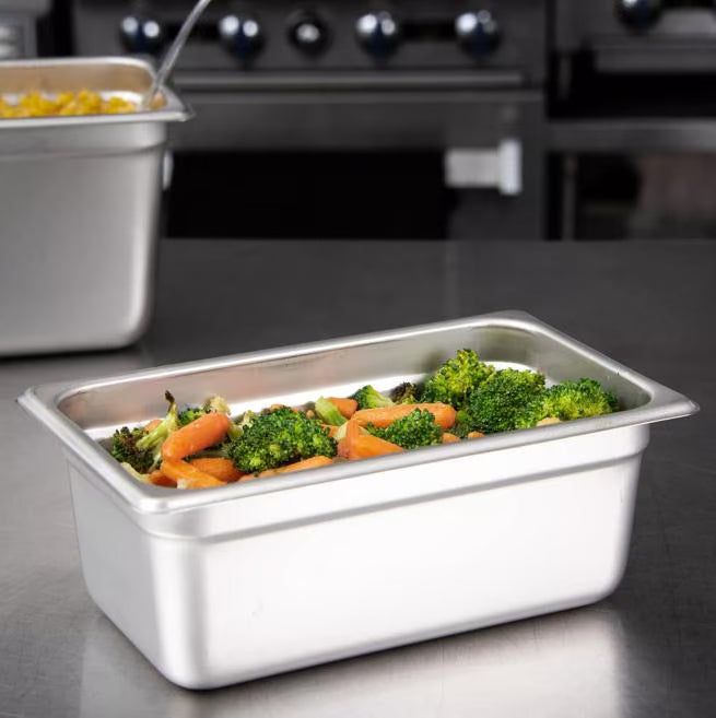 Prepare and serve food efficiently with the DuraPan Light Gauge Stainless Steel Steam Table Hotel Pan 1/4 Size 4 Inch Deep 607144. Features spoonable bottoms, freezer-to-oven versatility, and Coldmaster compatibility.