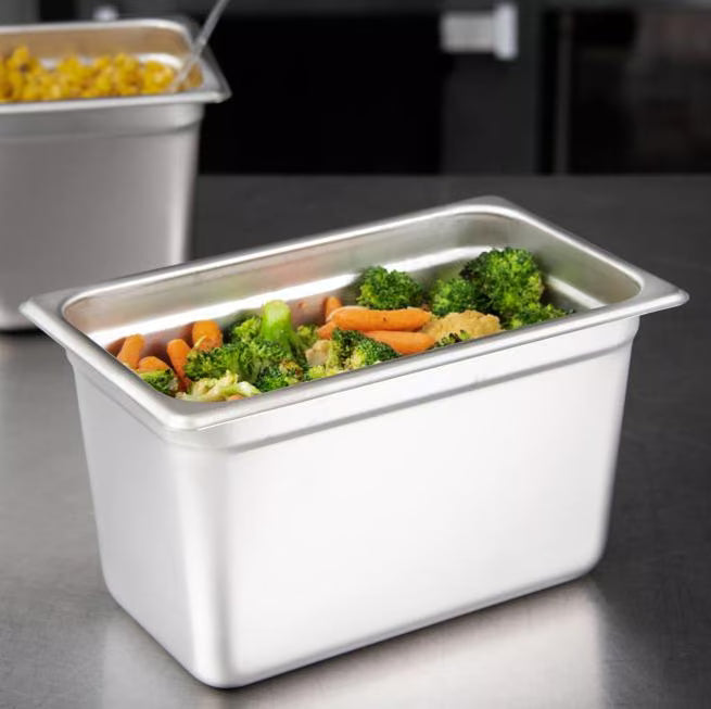 Prepare and serve food efficiently with the DuraPan Light Gauge Stainless Steel Steam Table Hotel Pan 1/4 Size 6 Inch Deep 607146. Features spoonable bottoms, freezer-to-oven versatility, and Coldmaster compatibility.
